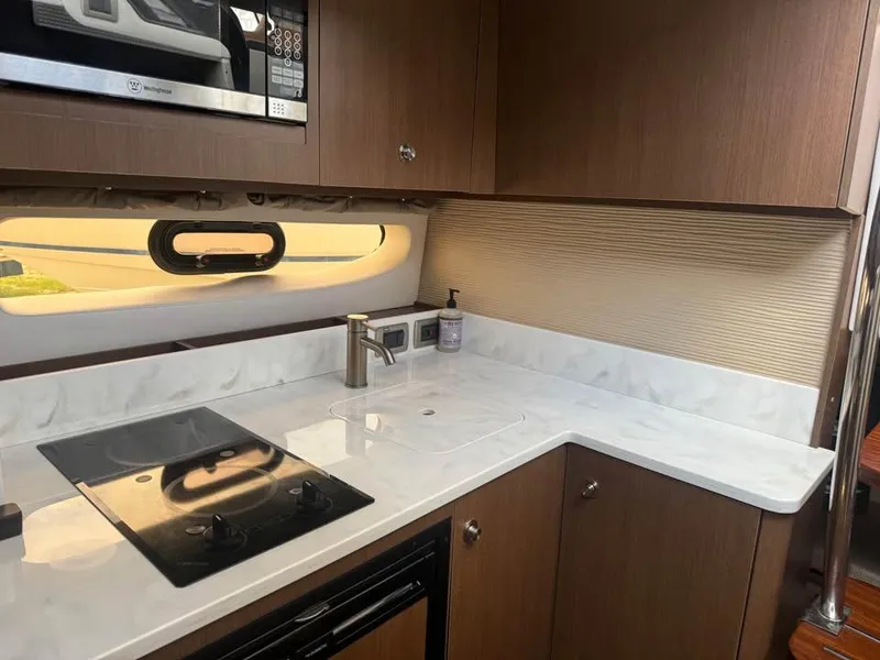 Slide: The Image of Modern kitchen interior of 2017 Sea Ray Sundancer 350 Coupe yacht. - 15