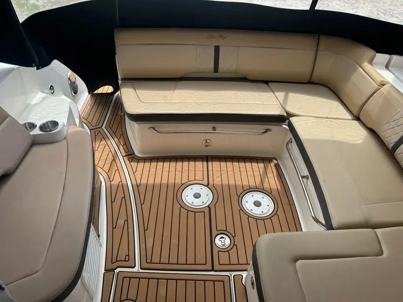 Slide: The Image of Interior of 2017 Sea Ray Sundancer 350 Coupe with beige seating and wood-patterned flooring. - 7