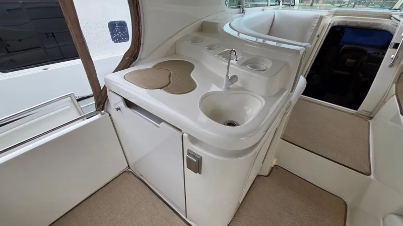 Slide: The Image of Interior of 2000 Cruisers Yachts 4450 Express Motoryacht with sink and countertop. - 14
