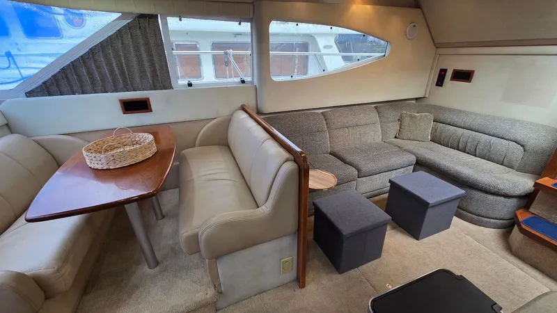 Slide: The Image of Interior of 2000 Cruisers Yachts 4450 Express Motoryacht with cozy seating area. - 31