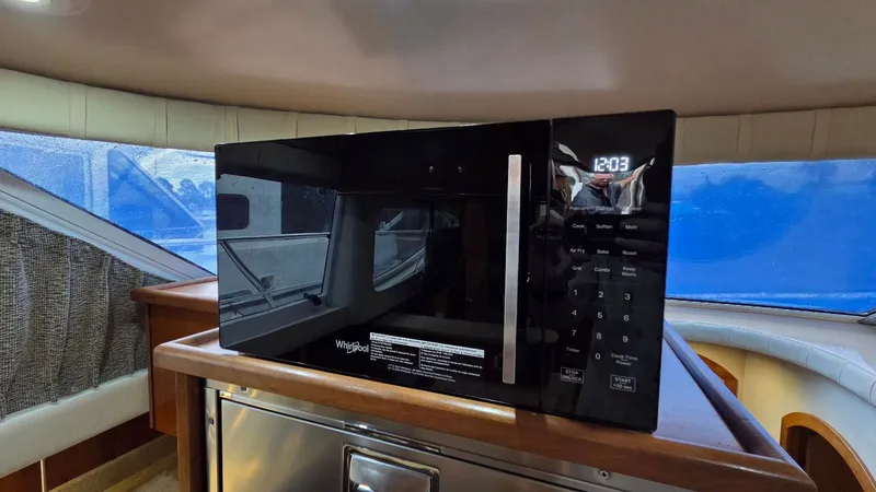 Slide: The Image of Whirlpool microwave in 2000 Cruisers Yachts 4450 Express Motoryacht interior. - 35