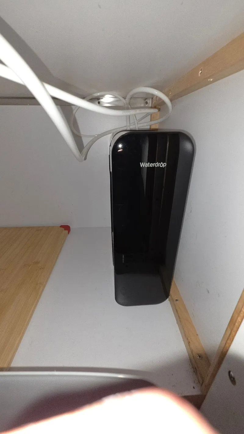 Slide: The Image of Waterdrop filtration device installed in a cabinet. - 43