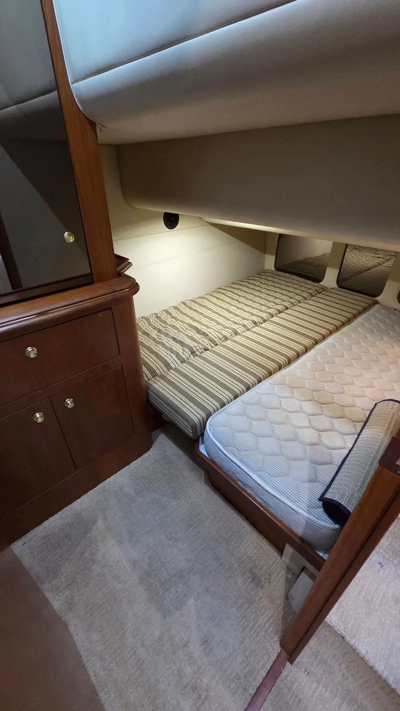 Slide: The Image of Interior of 2000 Cruisers Yachts 4450 Express Motoryacht with cozy sleeping area. - 45