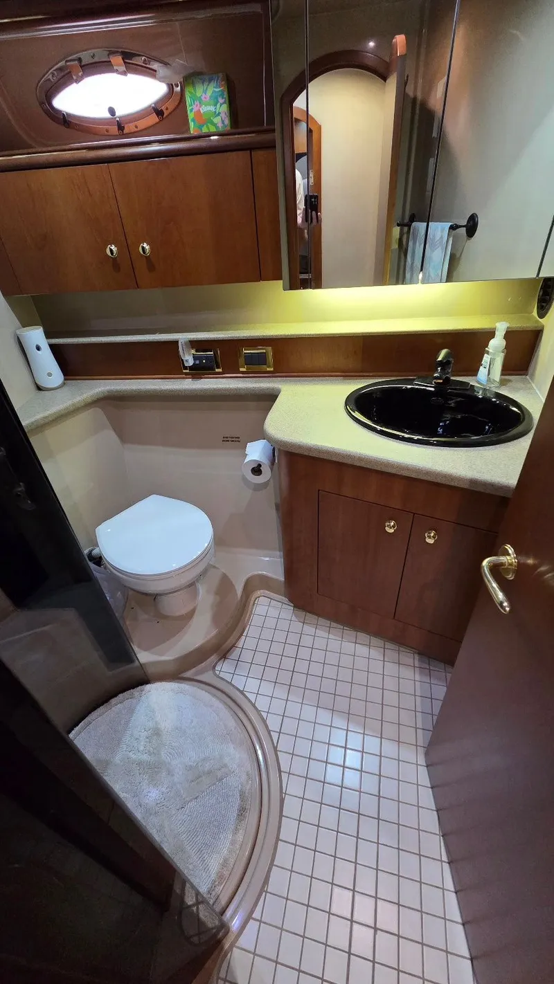 Slide: The Image of Luxurious bathroom in a 2000 Cruisers Yachts 4450 Express Motoryacht. - 47