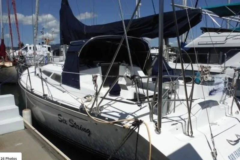 The Image of Sailboat docked at marina, C&C 110 model, year 2000, with dark blue covers. - 0
