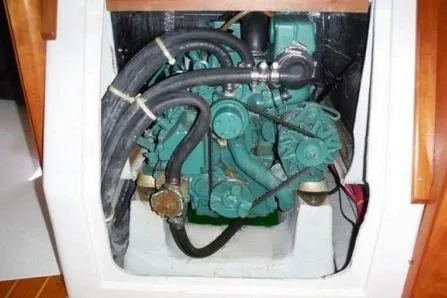 Slide: The Image of C&C 110 sailboat engine, 2000 model, with visible hoses and components. - 16