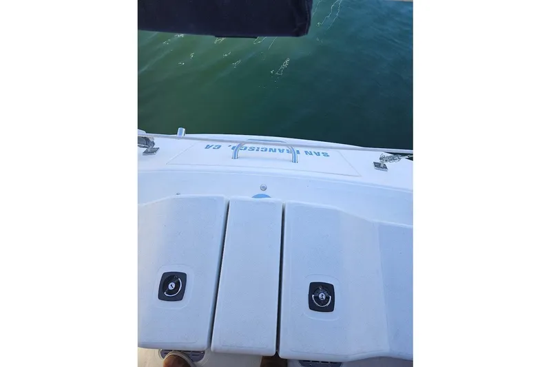 Slide: The Image of Rear view of a C&C 110 boat, 2000 model, on calm water. - 22