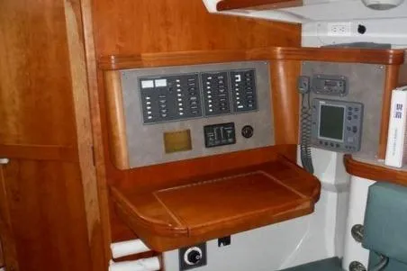 Slide: The Image of Navigation station with control panels in a 2000 C&C 110 sailboat interior. - 9
