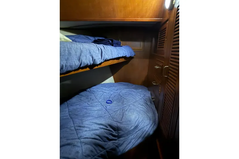 Slide: The Image of Cozy cabin with bunk beds in 1983 Ocean Alexander 43 Flush Aft Deck yacht. - 9