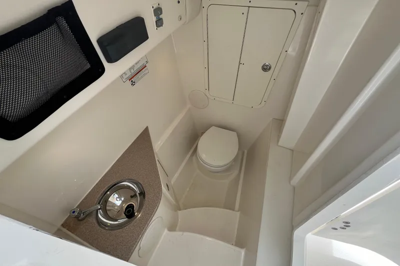 Slide: The Image of 2020 World Cat 296 DC boat interior with sink and toilet. - 15