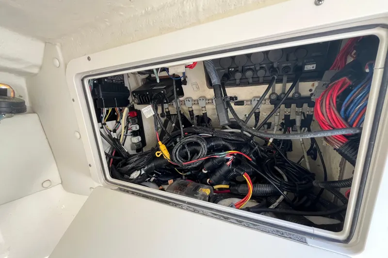 Slide: The Image of Electrical wiring compartment of a 2020 World Cat 296 DC boat. - 24