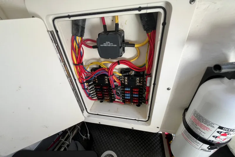 Slide: The Image of Electrical panel with wiring in a 2020 World Cat 296 DC boat. - 25