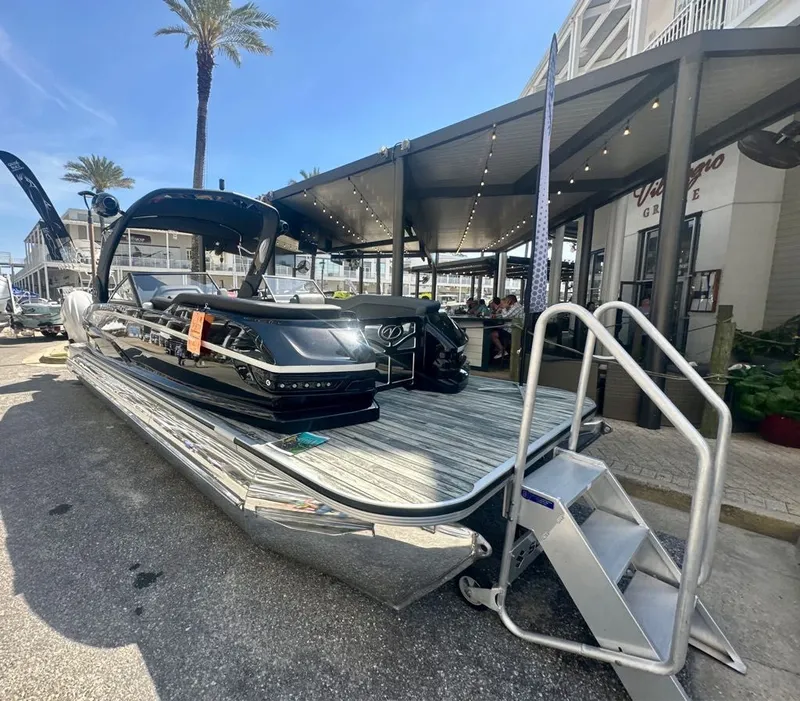 Slide: The Image of 2025 Veranda V One Series Twin Engine pontoon boat at dock. - 6