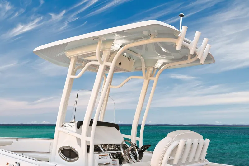 Slide: The Image of 2018 Robalo R242 Center Console boat with Garmin equipment, docked on a grassy area. - 7