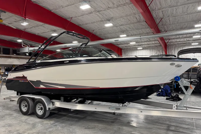 The Image of 2014 Monterey 268SS Super Sport boat on trailer in indoor storage facility. - 1