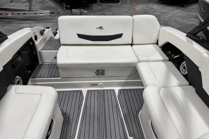 Slide: The Image of 2014 Monterey 268SS Super Sport boat interior with white seating and gray flooring. - 10