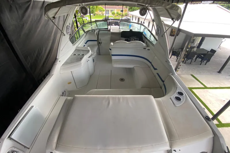 Slide: The Image of 2005 Formula 330 Sun Sport boat interior with white seating and modern amenities. - 18