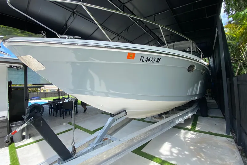 Slide: The Image of 2005 Formula 330 Sun Sport boat on trailer in covered storage area. - 5