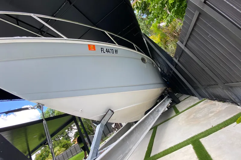 Slide: The Image of 2005 Formula 330 Sun Sport boat on trailer, parked under a canopy. - 6