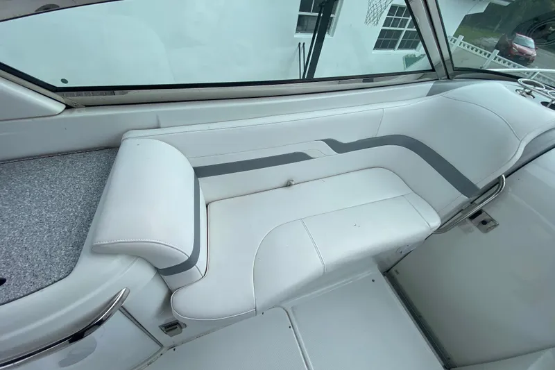 Slide: The Image of 2009 Formula 330 Sun Sport boat interior with white and gray seating. - 15