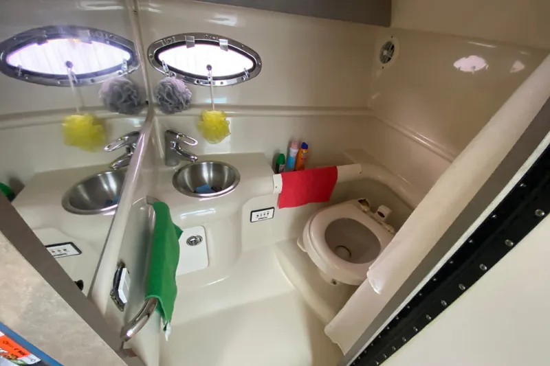 Slide: The Image of 2009 Formula 330 Sun Sport bathroom with sink, mirror, and toilet. - 23