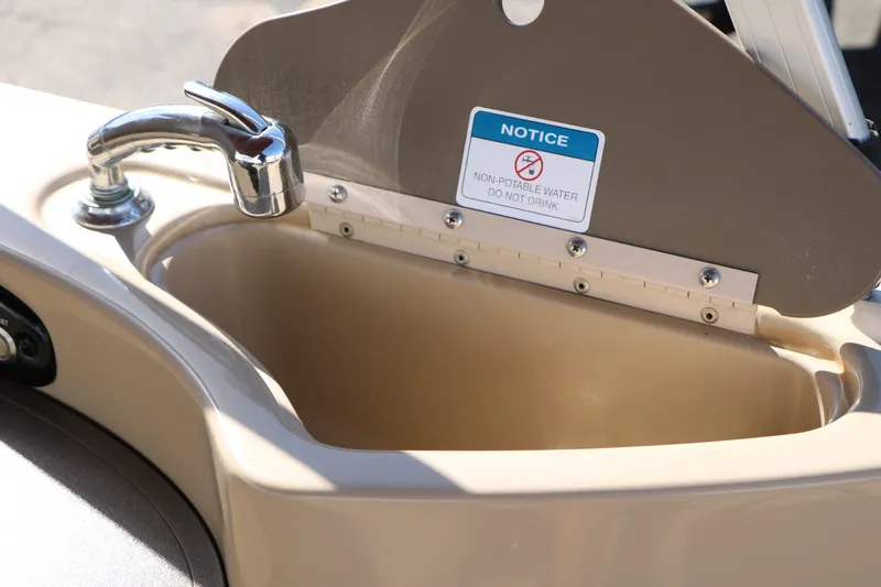 Slide: The Image of Sink on 2014 Sun Tracker Party Barge with warning notice. - 48