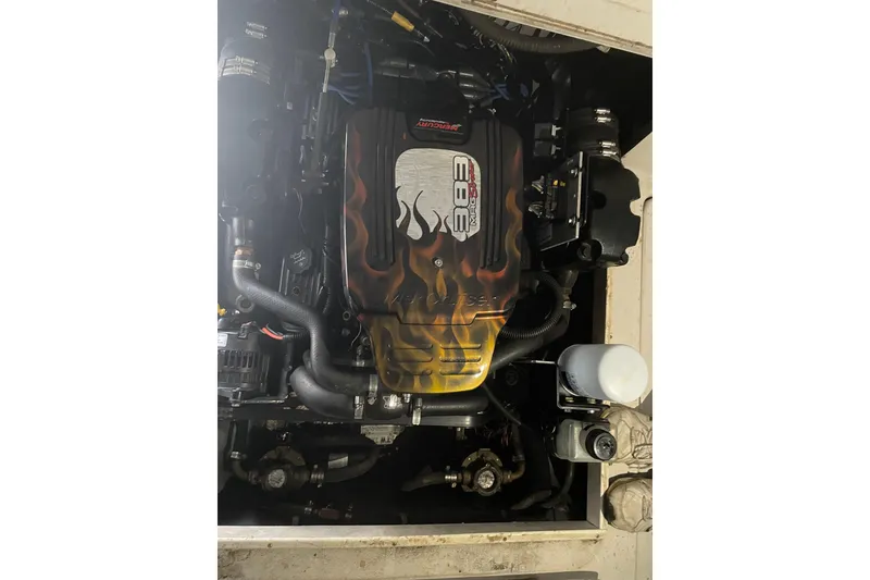 Slide: The Image of Engine of a 1996 Pro-Line 251 Walkaround boat with custom flame design. - 5
