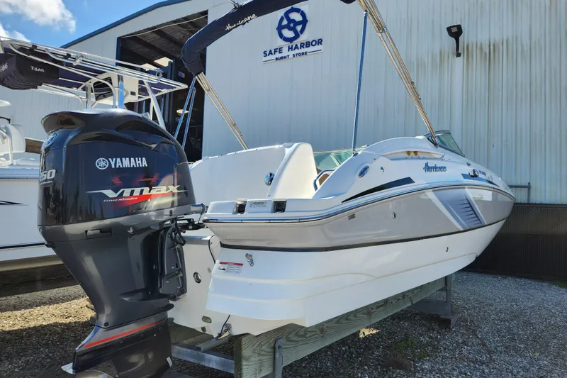 Slide: The Image of 2016 Hurricane SunDeck 2400 OB boat with Yamaha VMAX outboard motor at Safe Harbor. - 5