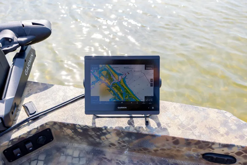 Slide: The Image of 2026 Excel 203 Bay Pro Elite boat with Garmin navigation system on water. - 12