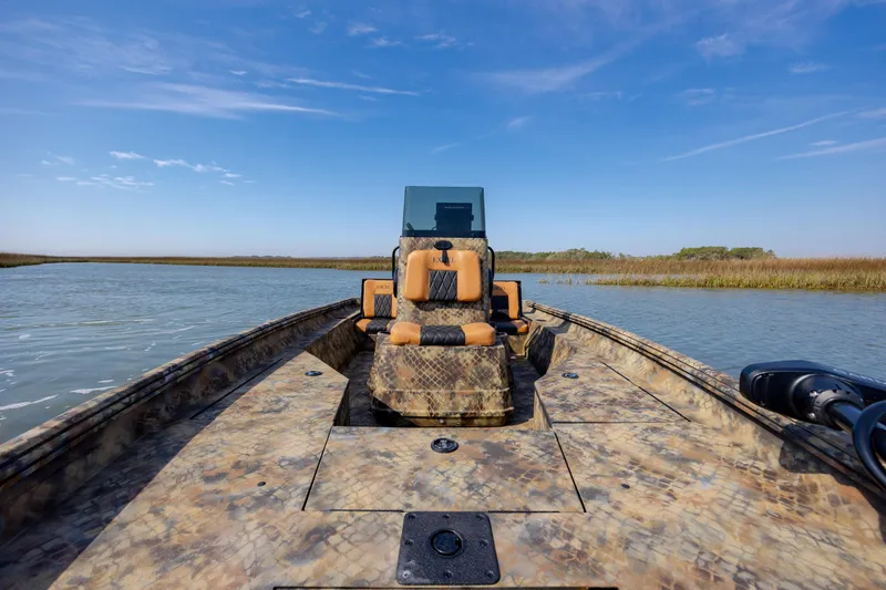 Slide: The Image of 2026 Excel 203 Bay Pro Elite boat on calm water with clear blue sky. - 19