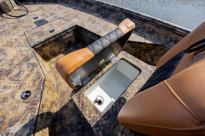 Slide: The Image of 2026 Excel 203 Bay Pro Elite boat interior with open storage compartment. - 22