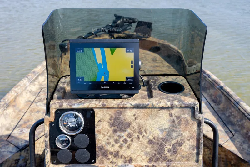 Slide: The Image of 2026 Excel 203 Bay Pro Elite boat dashboard with Garmin navigation system. - 26