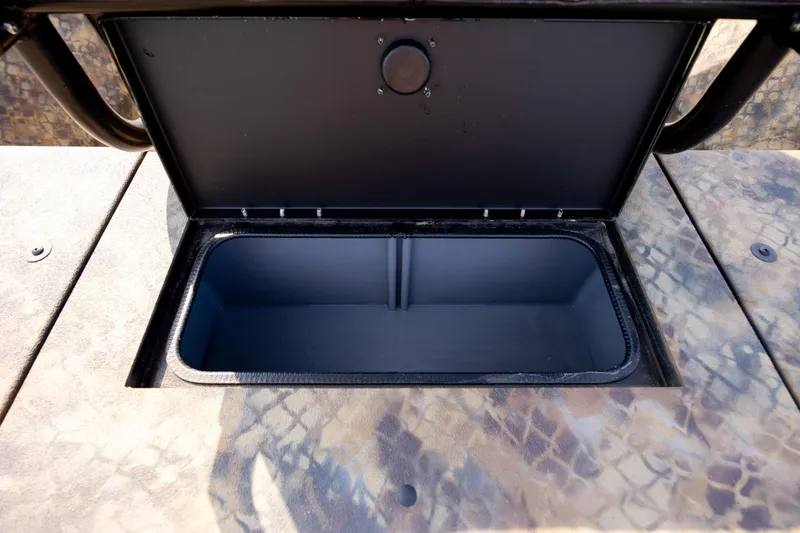 Slide: The Image of Open storage compartment on 2026 Excel 203 Bay Pro Elite boat. - 32