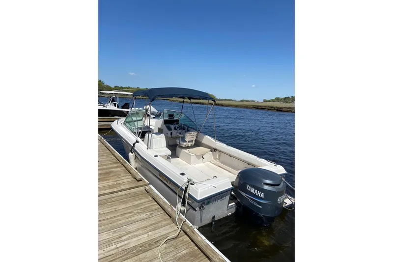 Slide: The Image of 2000 Grady-White Tournament 223 boat docked with Yamaha outboard motor. - 2