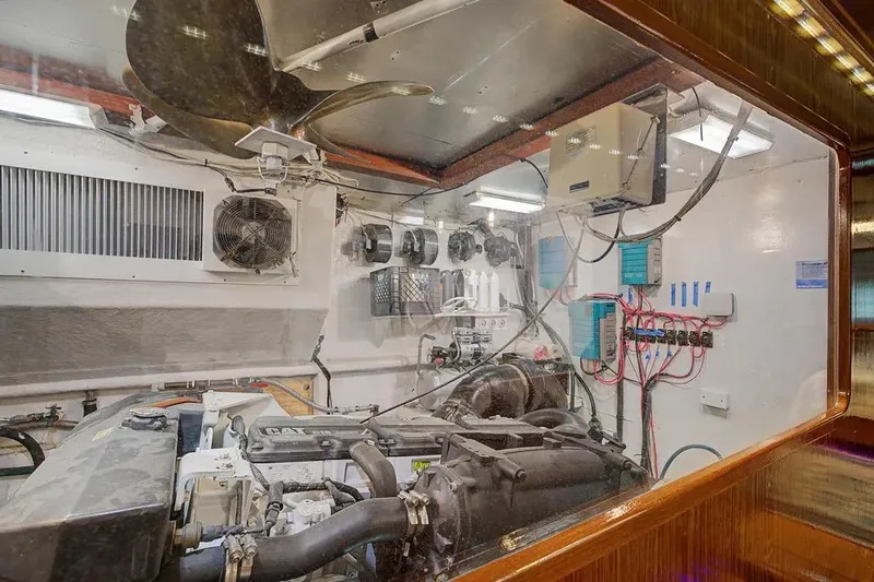 Slide: The Image of Engine room of 1989 Jefferson Marquessa 63 yacht, featuring mechanical and electrical components. - 42