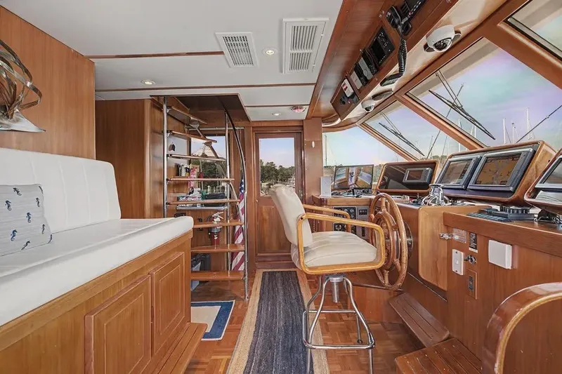 Slide: The Image of Luxurious interior of 1989 Jefferson Marquessa 63 yacht with wooden helm and navigation equipment. - 21