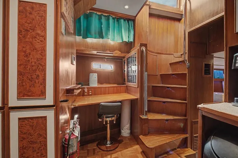 Slide: The Image of Interior of 1989 Jefferson Marquessa 63 yacht with wooden decor and staircase. - 24