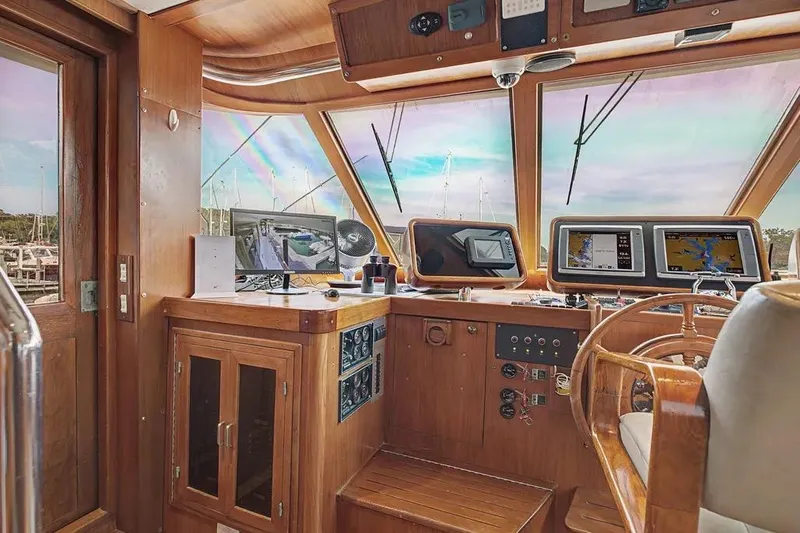 Slide: The Image of Interior helm of 1989 Jefferson Marquessa 63 yacht with navigation equipment and wooden finishes. - 3