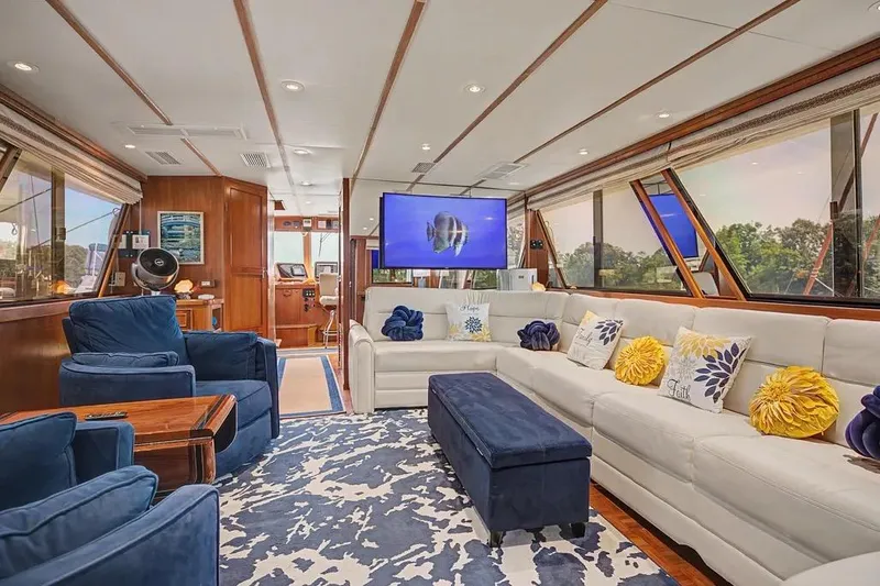 Slide: The Image of Luxurious interior of 1989 Jefferson Marquessa 63 yacht with plush seating and elegant decor. - 14