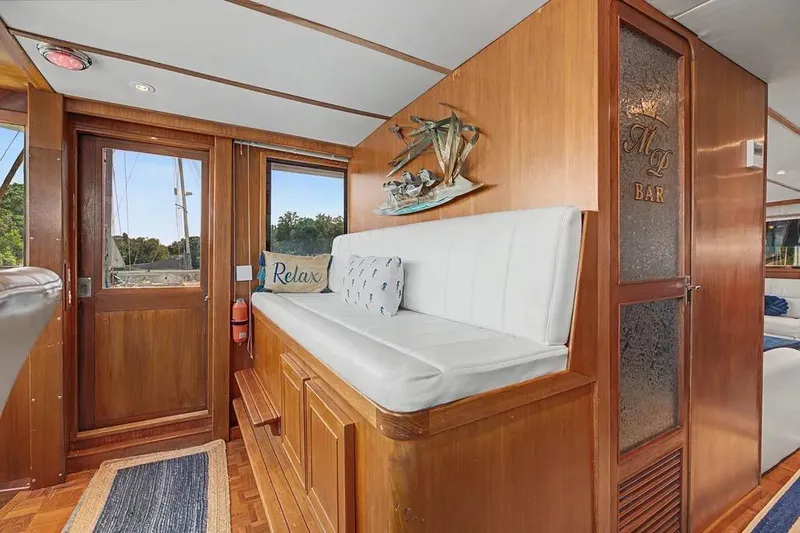 Slide: The Image of Interior of 1989 Jefferson Marquessa 63 yacht with wooden decor and seating area. - 5