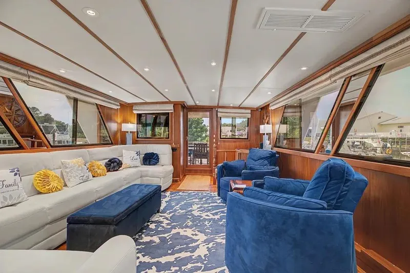 Slide: The Image of Luxurious interior of 1989 Jefferson Marquessa 63 yacht with plush seating and elegant decor. - 12