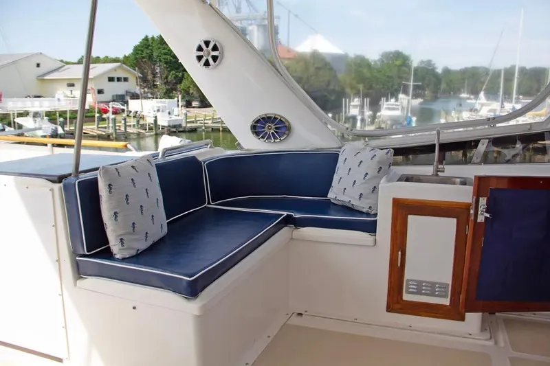 Slide: The Image of 1989 Jefferson Marquessa 63 yacht interior with blue seating and nautical-themed cushions. - 44