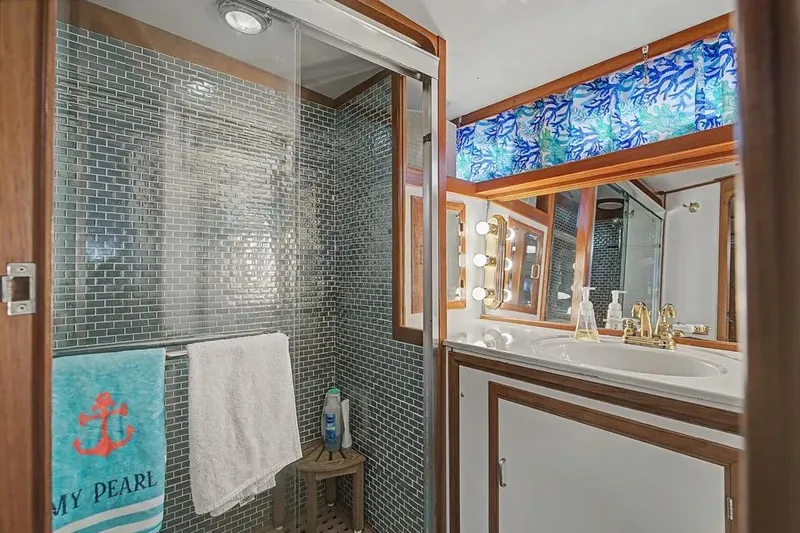 Slide: The Image of Luxurious bathroom on 1989 Jefferson Marquessa 63 yacht with glass shower and elegant vanity. - 37