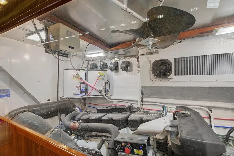 Slide: The Image of Engine room of 1989 Jefferson Marquessa 63 yacht, featuring mechanical components and ventilation system. - 40
