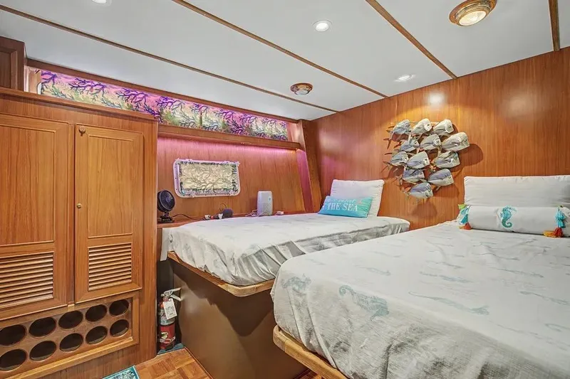 Slide: The Image of Cozy cabin interior of 1989 Jefferson Marquessa 63 yacht with twin beds and wooden decor. - 29