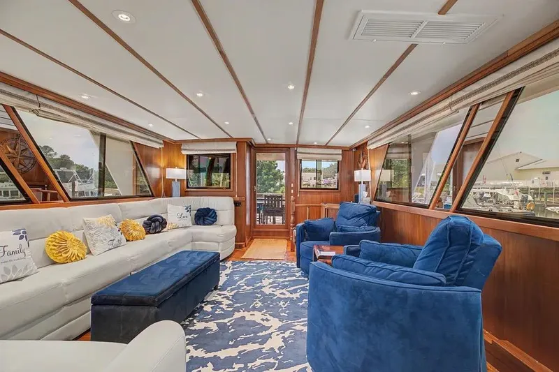Slide: The Image of Luxurious interior of 1989 Jefferson Marquessa 63 yacht with plush seating and elegant decor. - 13