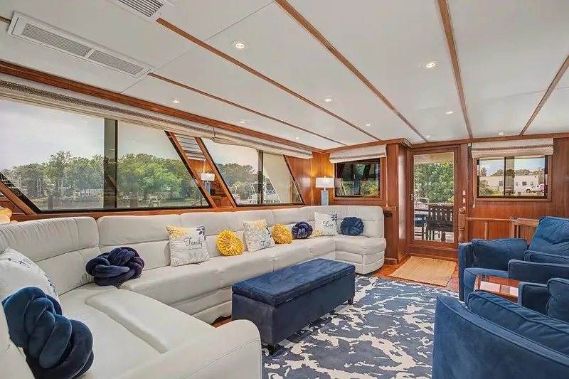 Slide: The Image of Luxurious interior of 1989 Jefferson Marquessa 63 yacht with plush seating and elegant decor. - 15