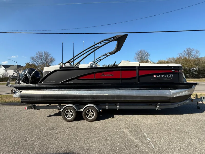 The Image of 2021 Barletta Corsa 23QCSS Coastal Edition on trailer, side view. - 0