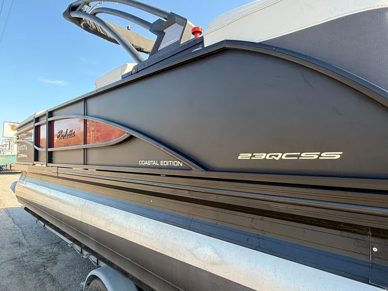 Slide: The Image of 2021 Barletta Corsa 23QCSS Coastal Edition pontoon boat side view. - 12