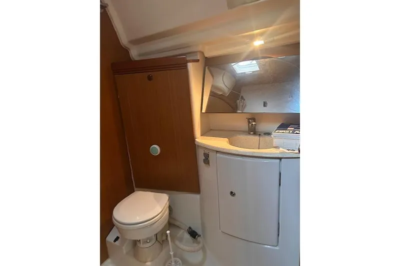 Slide: The Image of Bathroom interior of 2007 Jeanneau Sun Odyssey 42 DS yacht, featuring sink and toilet. - 13